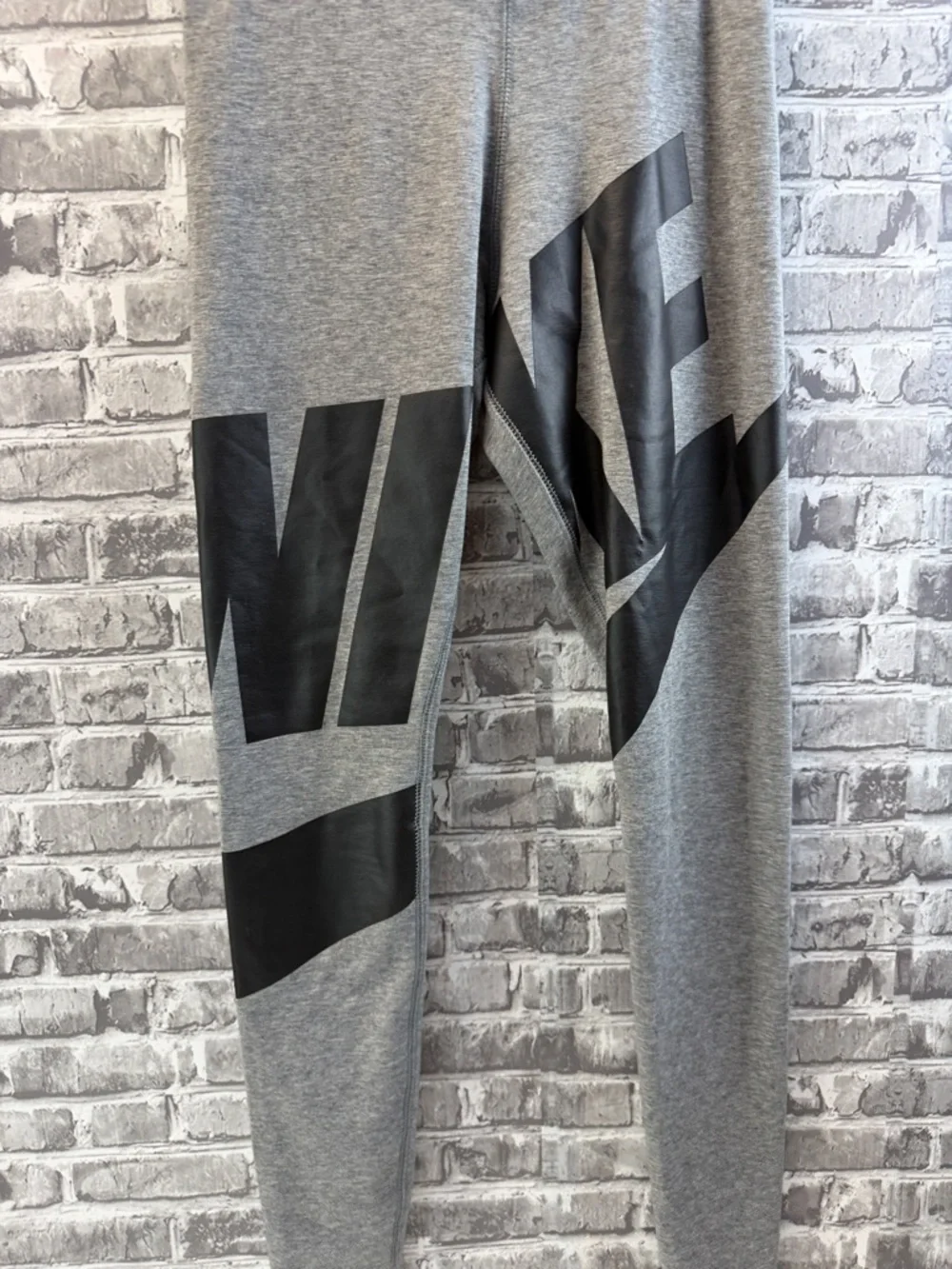 Nike Gray Athletic Leggings with Bold Black Graphic